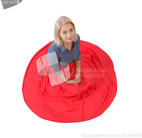 Image of The beautiful blonde in a red skirt