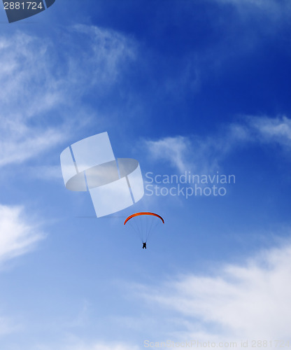 Image of Silhouette of skydiver at sky