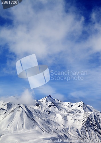 Image of Winter snowy mountains at windy day