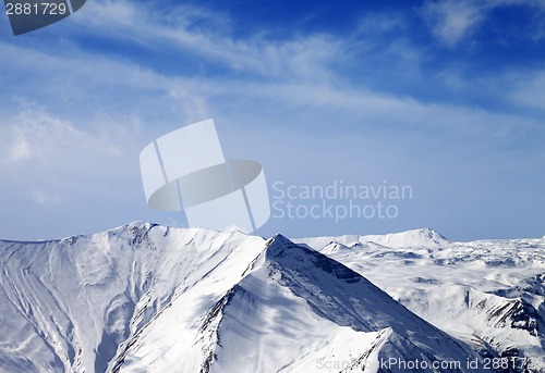 Image of Snowy mountains at sunny day