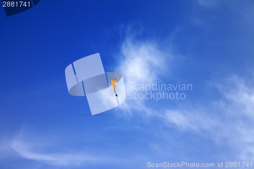 Image of Skydivers in blue sky at sun day