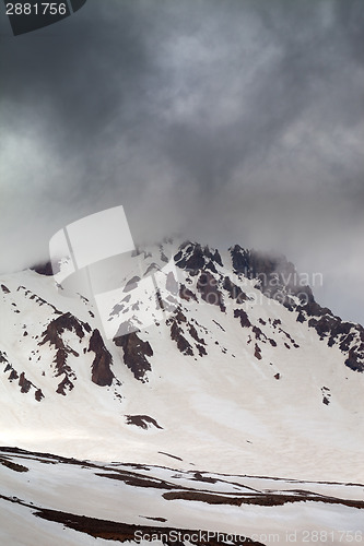 Image of Top of mountains in storm clouds