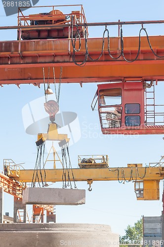 Image of Operator of crane works at finished good warehouse