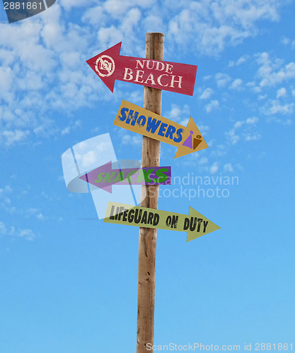 Image of four arrows beach directional post