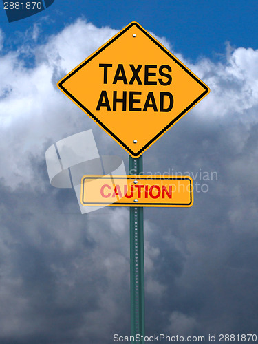 Image of caution taxes ahead post sign