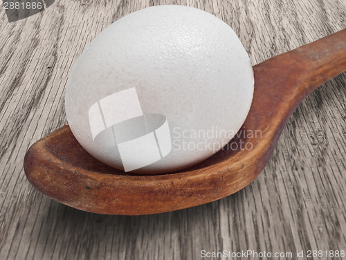 Image of vintage wooden spoon and egg 