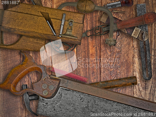 Image of vintage woodworking tools on wooden bench