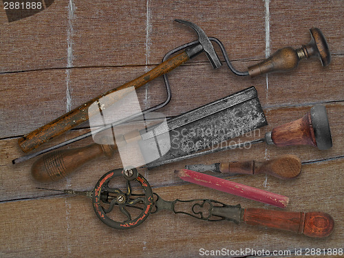 Image of vintage woodworking tools over drift wood