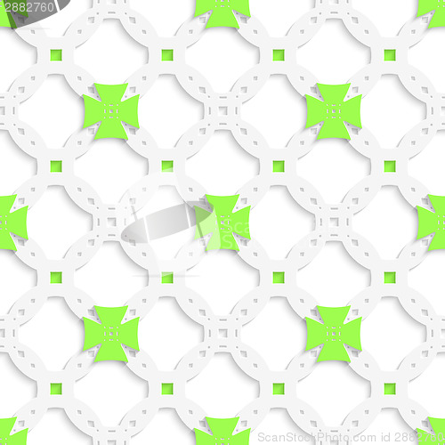 Image of White perforated ornament with green crosses seamless