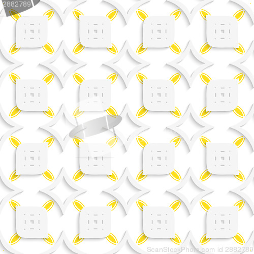Image of White and yellow geometrical perforated leaves and rhombuses sea