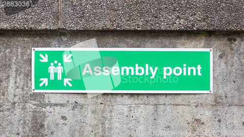 Image of Green plastic 'assembly point' sign