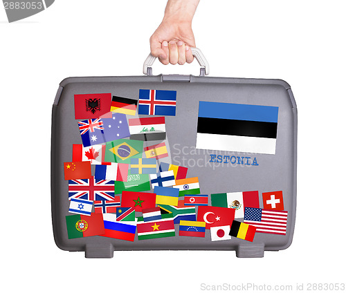 Image of Used plastic suitcase with stickers