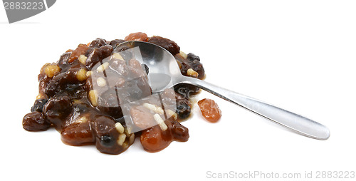 Image of Heap of mincemeat mixture with a metal teaspoon 