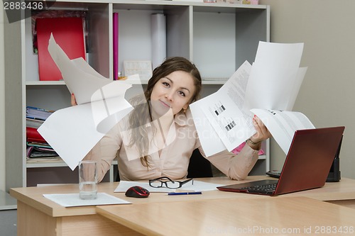 Image of Office Specialist with a bunch of papers