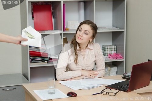 Image of Head give a bribe the workplace in office