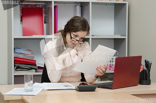 Image of Accountant reading an important document