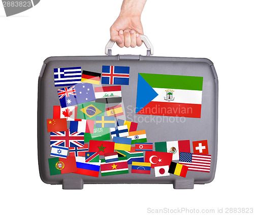 Image of Used plastic suitcase with stickers