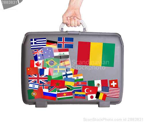 Image of Used plastic suitcase with stickers