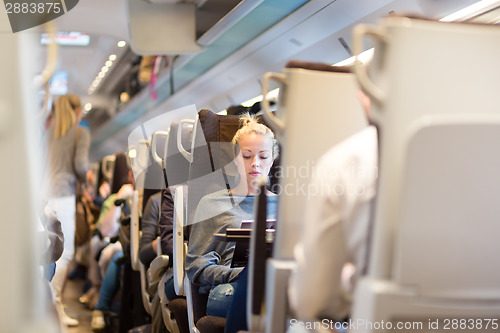 Image of Lady traveling by train.