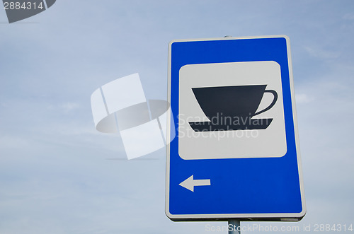 Image of blue road sign show for coffee bar restaurant inn 