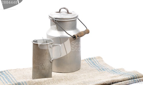 Image of Graduated jug and milk can