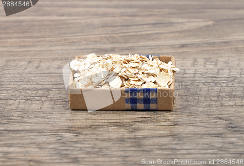 Image of Oat flakes on wood