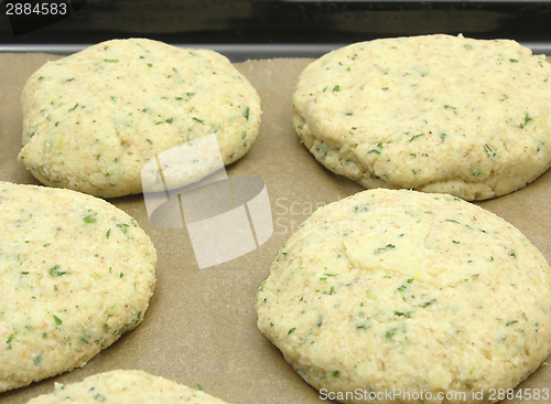 Image of Potato herbs burger on a baking tray