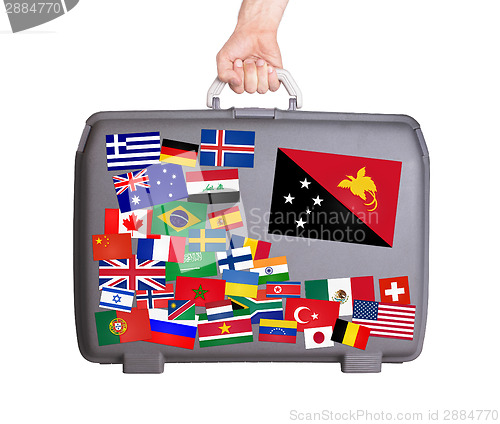 Image of Used plastic suitcase with stickers