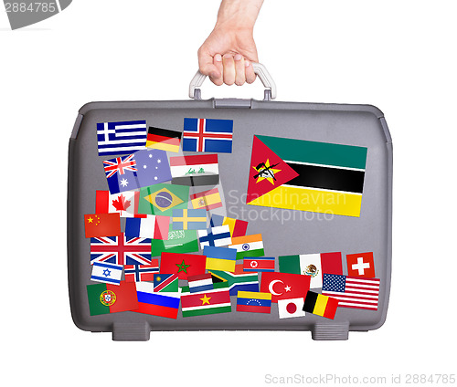 Image of Used plastic suitcase with stickers