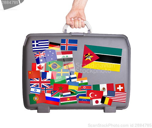 Image of Used plastic suitcase with stickers