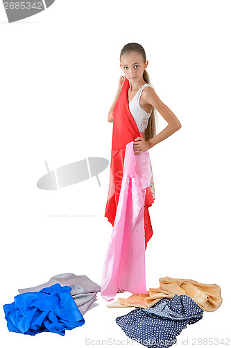 Image of The girl tries on fabric