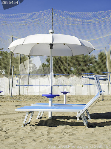 Image of Sunbeds and umbrellas on the beach