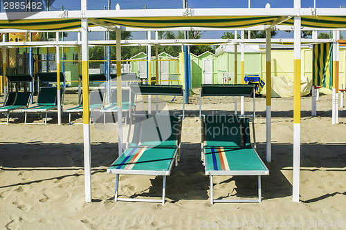 Image of Sunbeds and umbrellas on the beach