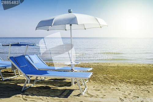 Image of Sunbeds and umbrellas on the beach