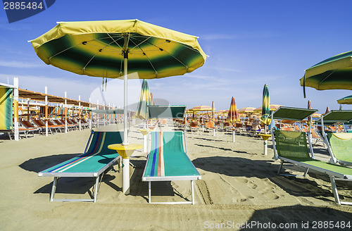 Image of Sunbeds and umbrellas on the beach