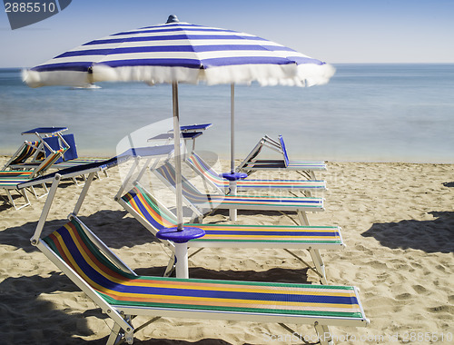 Image of Sunbeds and umbrellas on the beach