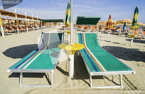 Image of Sunbeds and umbrellas on the beach