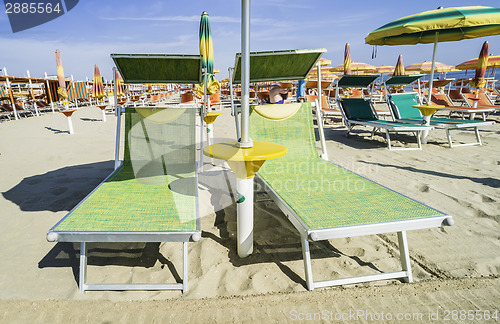 Image of Sunbeds and umbrellas on the beach