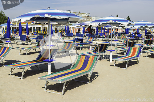 Image of Sunbeds and umbrellas on the beach