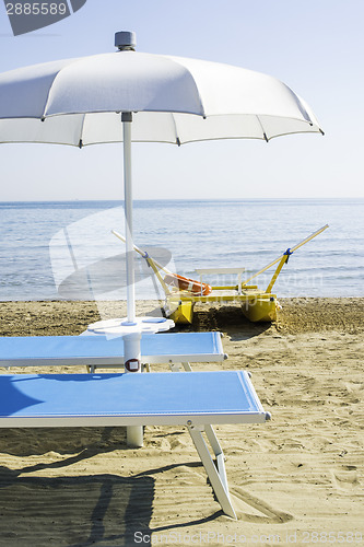 Image of Sunbeds and umbrellas on the beach