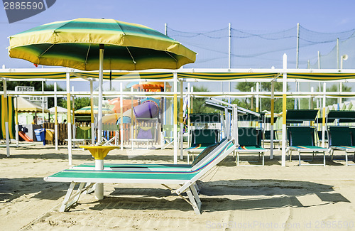 Image of Sunbeds and umbrellas on the beach