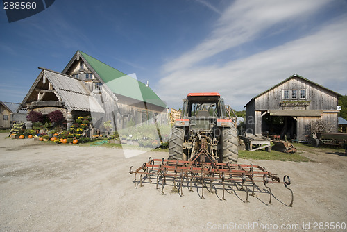 Image of tractor tiller in front of garden center in rural vermont