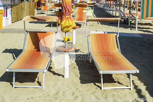 Image of Sunbeds and umbrellas on the beach