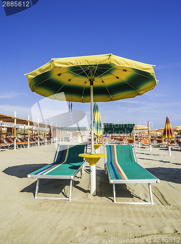 Image of Sunbeds and umbrellas on the beach