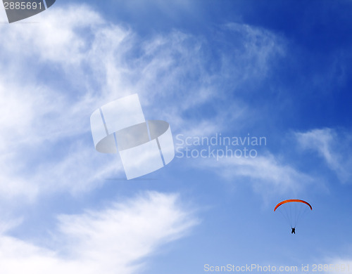 Image of Silhouette of skydiver at sky