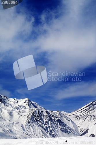 Image of Winter mountains and blue sky with clouds