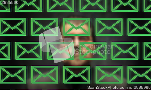 Image of Ominous character monitoring e-mail messages