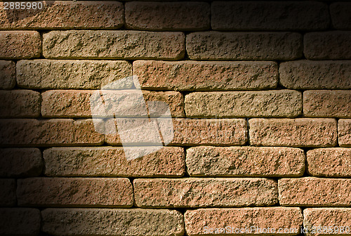 Image of Rough red brick lit diagonally