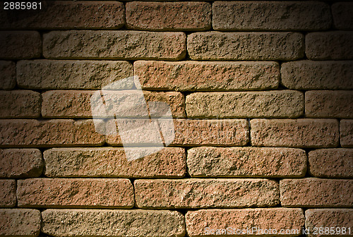 Image of Rough red brick background lit from above