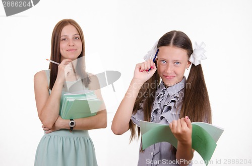 Image of Portrait of a teacher and student with notebooks